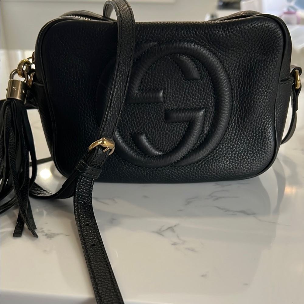 Gucci Black Crossbody Bag with Embossed Logo and Tassel